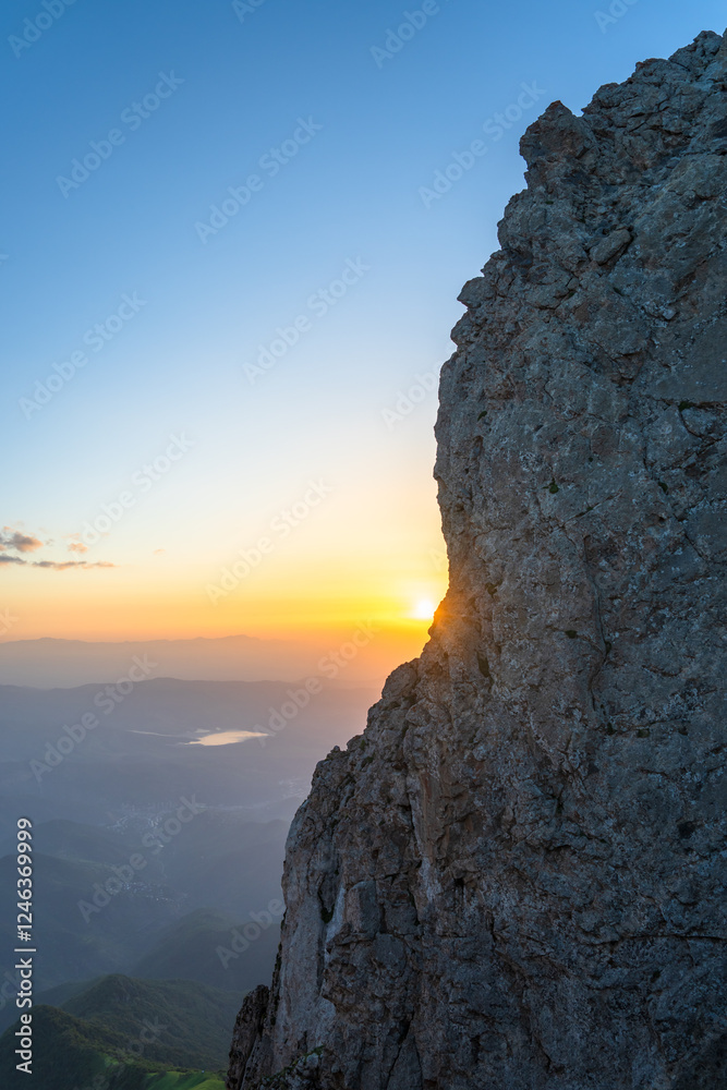 The Sunset Seen Through the Rocks, A Beautiful View The Sunset Seen Through the Rocks, A Beautiful View