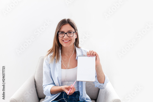 Woman working from home office. Girl looking at camera, talking on virtual call. Businesswoman in monitor screen during video conference, online meeting. People connection, communication photo