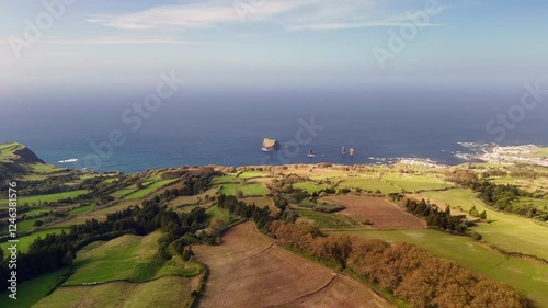 Mosteiros, Azores from a bird's-eye view. The Atlantic Ocean, with its powerful waves crashing against the rugged coastline.
A black sand beach and cliffs, formed from solidified lava, stand as a tes