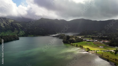 Sete Cidades, São Miguel, Azores, Volcanic Caldera. A depression formed after a volcanic eruption, now filled with two lakes – one blue (Lagoa Azul) and the other green (Lagoa Verde). King's Bridge (P
