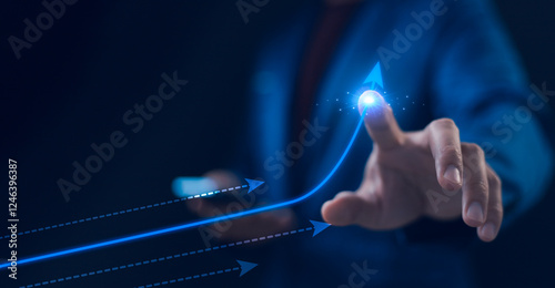 Obraz na płótnie Businessman touching a glowing upward arrow, business growth and success growing growth concept. Pointing arrow graph corporate future growth plan. Successful business development plan. w salonie