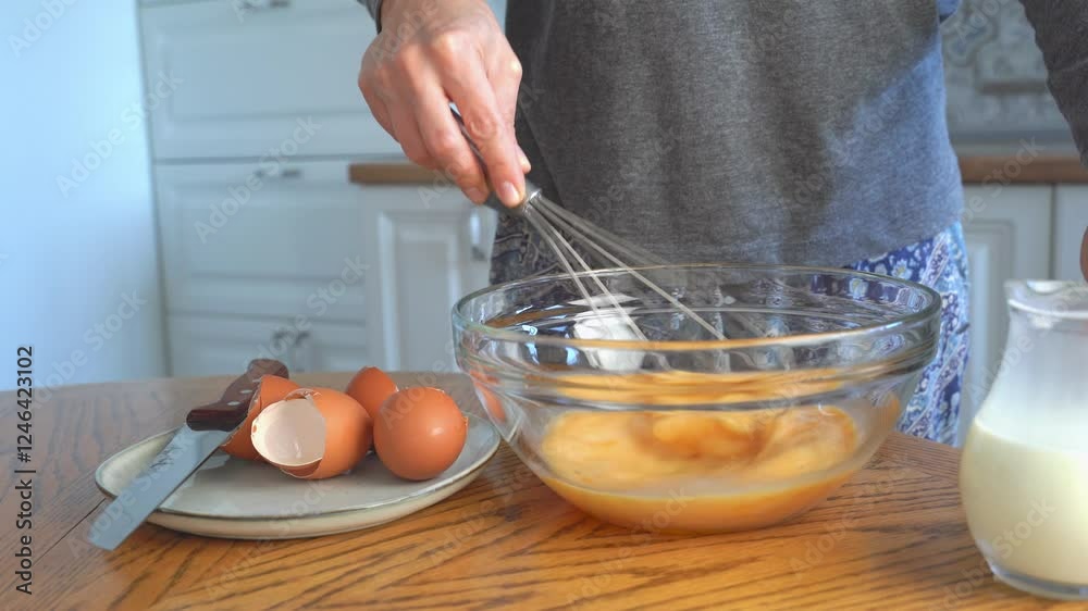 Cooking process, beat eggs with a whisk, pour in milk. Breakfast dish omelette, dough. Cooking process, beat eggs with a whisk, pour in milk. Breakfast dish omelette, dough.