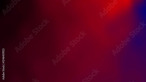 A vibrant abstract background with a blend of red and purple hues.