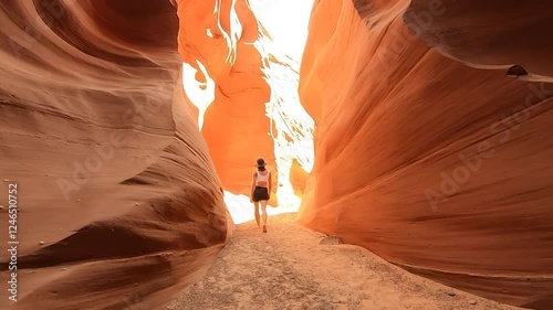 Wandering through the mesmerizing curves of Antelope Canyon's sandstone passageways, lit with a stunning play of natural light.