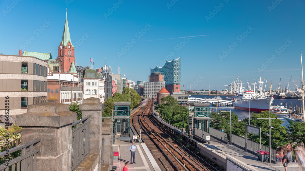 Obraz premium Aerial hyperlapse of trains arriving at Landungsbrucken station in Hamburg, Germany
