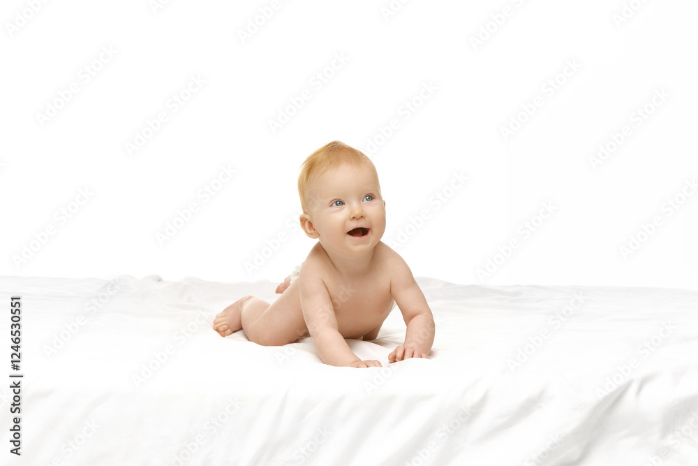 Happy, playful baby, girl, child in diaper crawling in bed with smiling, playful face against white studio background. Learning activity. Concept of childhood, motherhood, care. Copy space for ad Happy, playful baby, girl, child in diaper crawling in bed with smiling, playful face against white studio background. Learning activity. Concept of childhood, motherhood, care. Copy space for ad