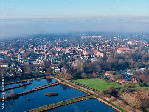 Luftbild des historischen Stadtkerns der Stadt Rietberg im Kreis Gütersloh im Winter, Nebelwand, Ostwestfalen-Lippe, Nordrhein-Westfalen photo