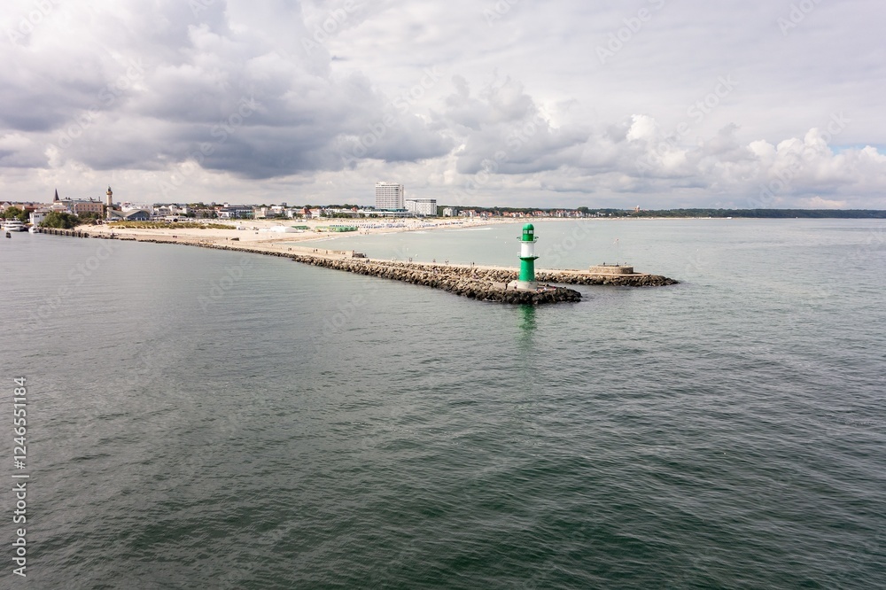 Landscape with famous green lighthouse at Westmole (Molenfeuer Warnemunde) in Rostock