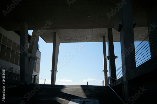 Building structure with tall pillars silhouetted against a bright blue sky, Miami, FLorida, USA photo