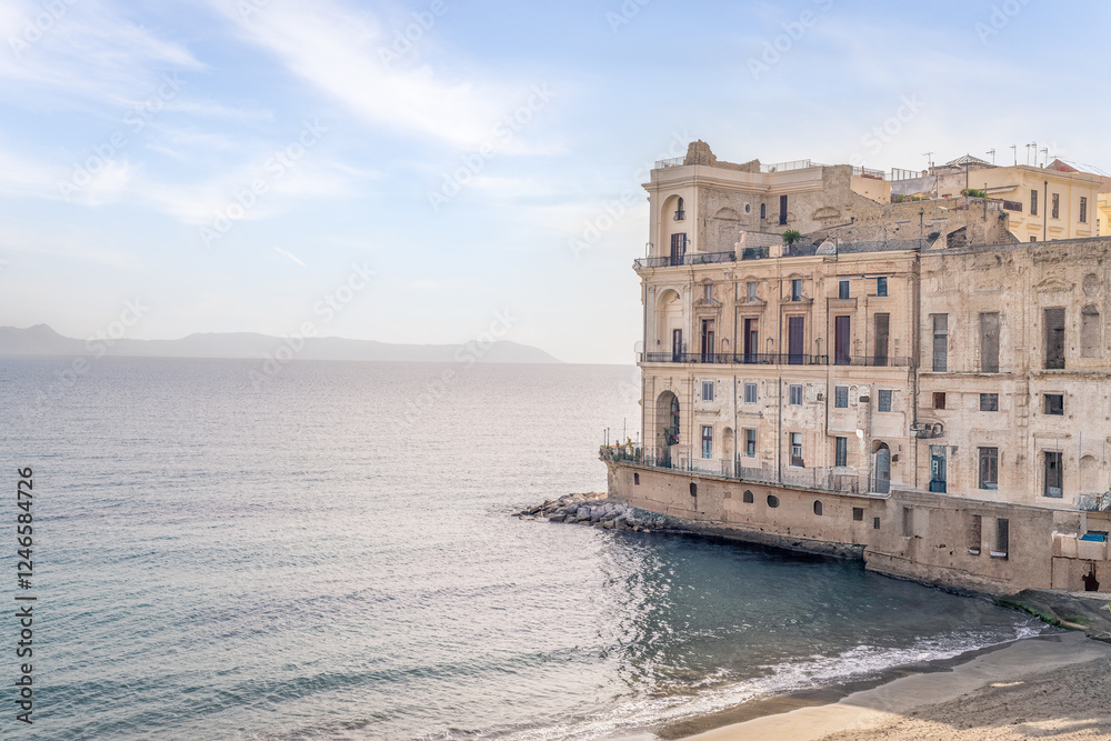 Naples coastline, historic buildings, Mediterranean Sea.
