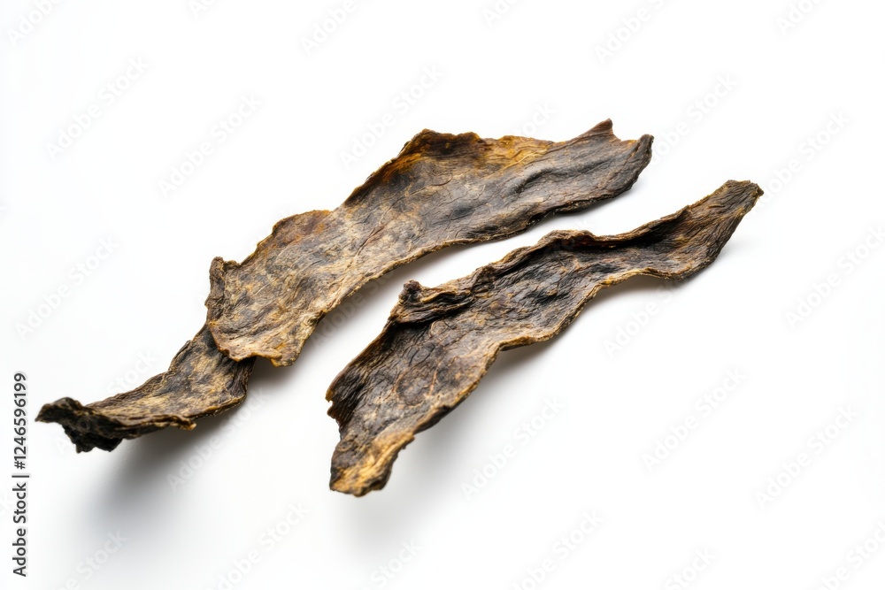 Savory beef jerky pieces showcasing rich texture and flavor on a clean white background Savory beef jerky pieces showcasing rich texture and flavor on a clean white background