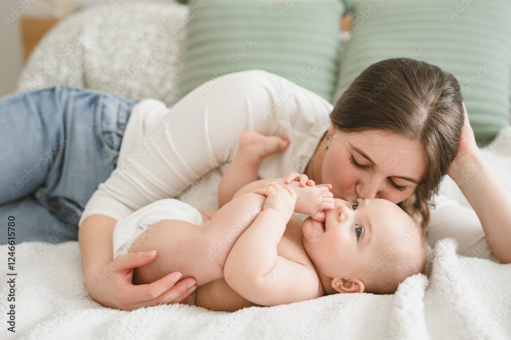portrait of happy young mother and infant girl on bedroom portrait of happy young mother and infant girl on bedroom