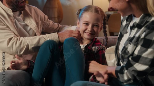 Wallpaper Mural Happy active Caucasian family playing together on couch living room at home evening night carefree parents mother woman man father tickling little daughter child kid girl tickle laughing fun fooling Torontodigital.ca