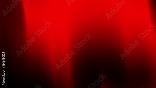 A vibrant abstract gradient of red tones creating a dynamic visual effect.