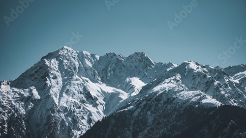 Konstfotografi Scenic view of snowcapped mountains against blue sky