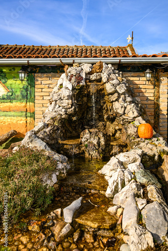 Obraz na płótnie Novi Sad, Serbia- January 26, 2025: Vojvodina farm (Serbian; Vojvodjanski Salaš) a beautiful restaurant near Novi Sad. Decorated small waterfall w salonie
