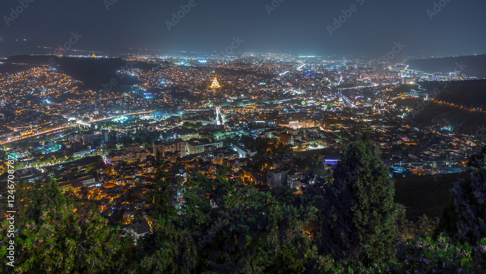 Naklejka premium Tbilisi cityscape, Georgia day to night aerial timelapse. Top view over the city center and Kura river in Tbilisi.