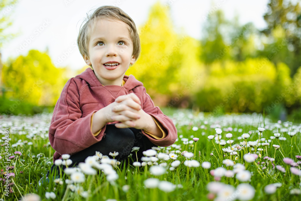 Adorable little boy having fun outdoors on sunny summer day. Kid running outdoors. Child exploring nature. Summer activities for kids. Adorable little boy having fun outdoors on sunny summer day. Kid running outdoors. Child exploring nature. Summer activities for kids.
