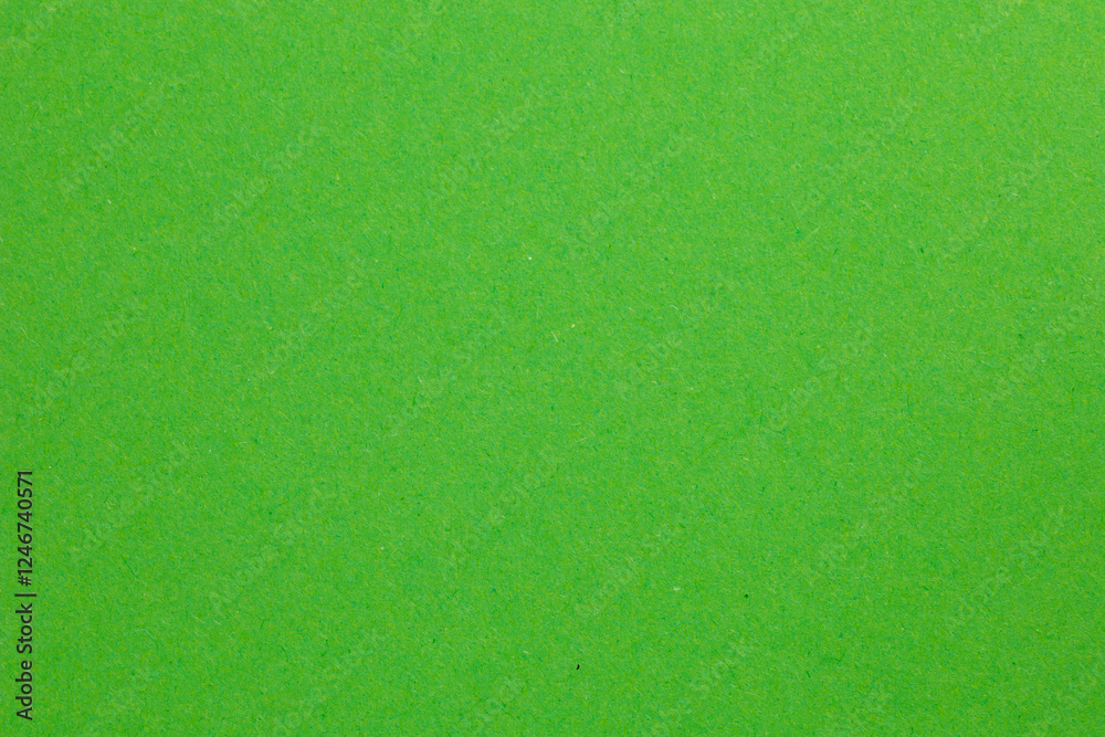 A green field with grass and a few trees, textured origami paper backdrop A green field with grass and a few trees, textured origami paper backdrop