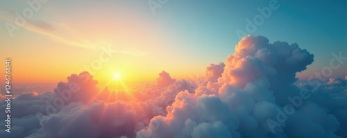 Warm sunlight casts a golden glow on puffy white clouds suspended in the cerulean blue sky at dusk, warm, sun, sunsets