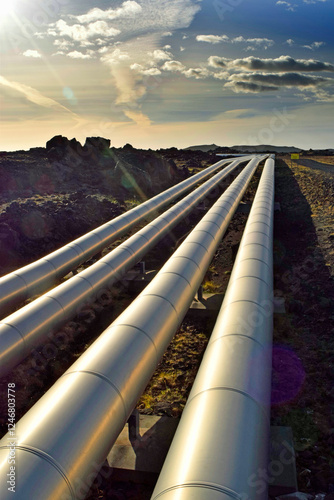Geothermal pipes carrying hot water to Reykjavik, Iceland. Geothermal power systems harness the energy in water and steam that have been heated naturally within the Earth's crust.