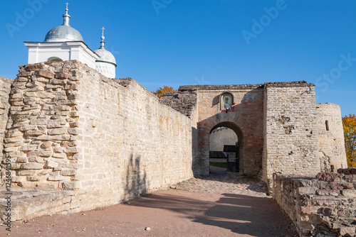 Zahab and gate of the ancient Izborsk fortress on a sunny October day. Pskov region