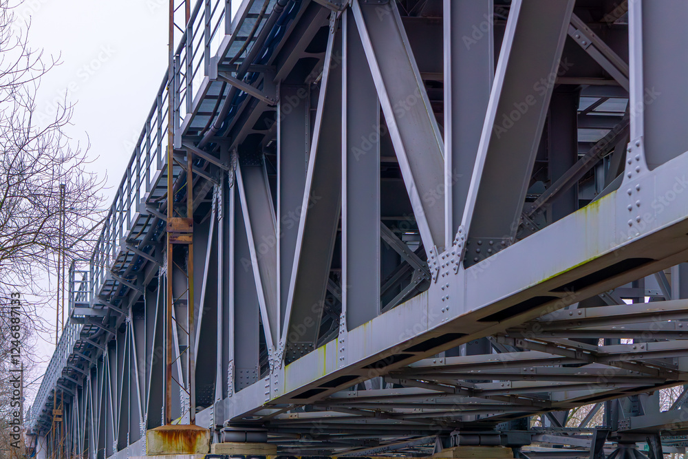 construction of a large railway bridge over the river. steel and metal bridge. rivets. construction of a large railway bridge over the river. steel and metal bridge. rivets.