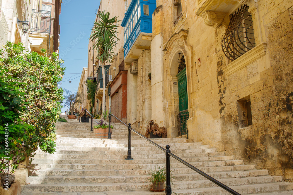 Obraz premium Touristic street with stairs in the center of Valletta, Malta