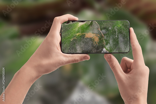 Εκτύπωση καμβά Man using mobile phone to recognize disease of house plant, closeup