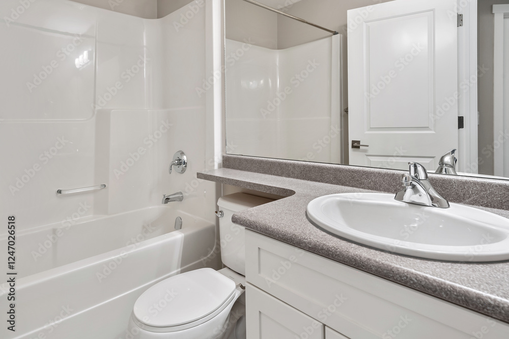 Fototapeta premium A bathroom with a white toilet and sink
