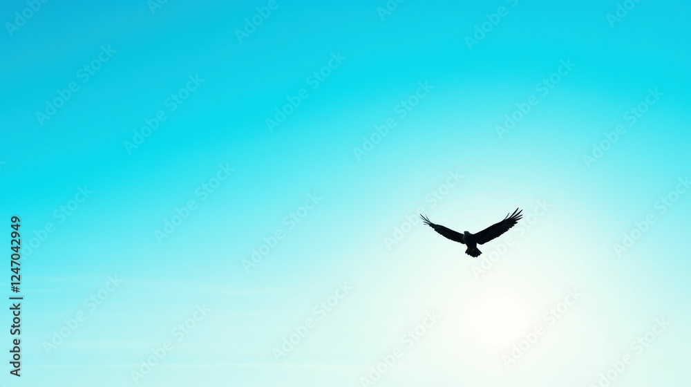Fototapeta premium Majestic bird soars against a clear blue sky in serene nature scene