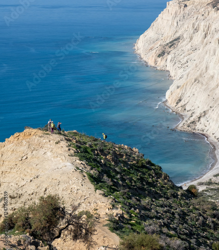 Group of people trekking in nature on a hiking trail. Healthy lifestyle. Exercising outdoor