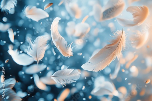 Soft white feathers floating gracefully in a serene blue background