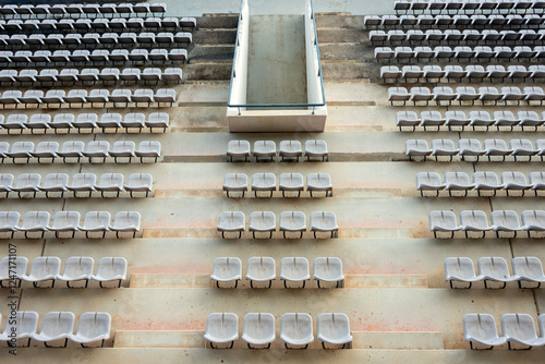 Canvas Print rows of plastic stadium grandstand seats, from above, empty