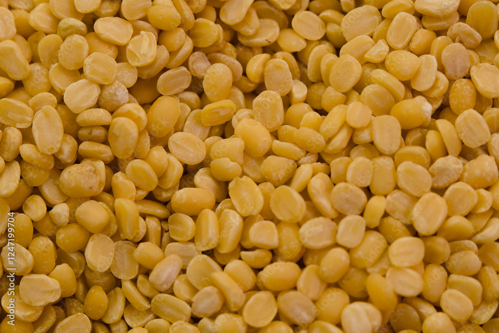 Neatly arranged yellow split peas highlighting their texture and color Neatly arranged yellow split peas highlighting their texture and color