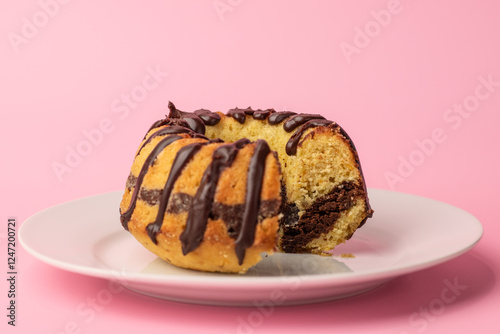 a small marble cake with chocolate cut
