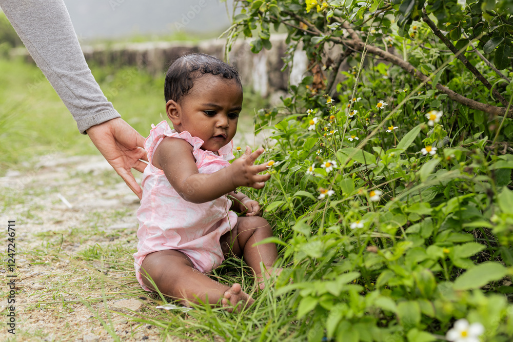 Happy baby girl on her first time playing in nature. Rio de Janeiro, Brazil. Happy baby girl on her first time playing in nature. Rio de Janeiro, Brazil.
