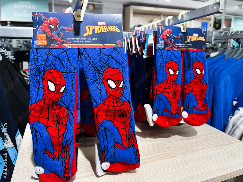 Obraz premium Kyiv, Ukraine - February 05, 2025: Children's socks featuring Spiderman character design displayed in a clothing store