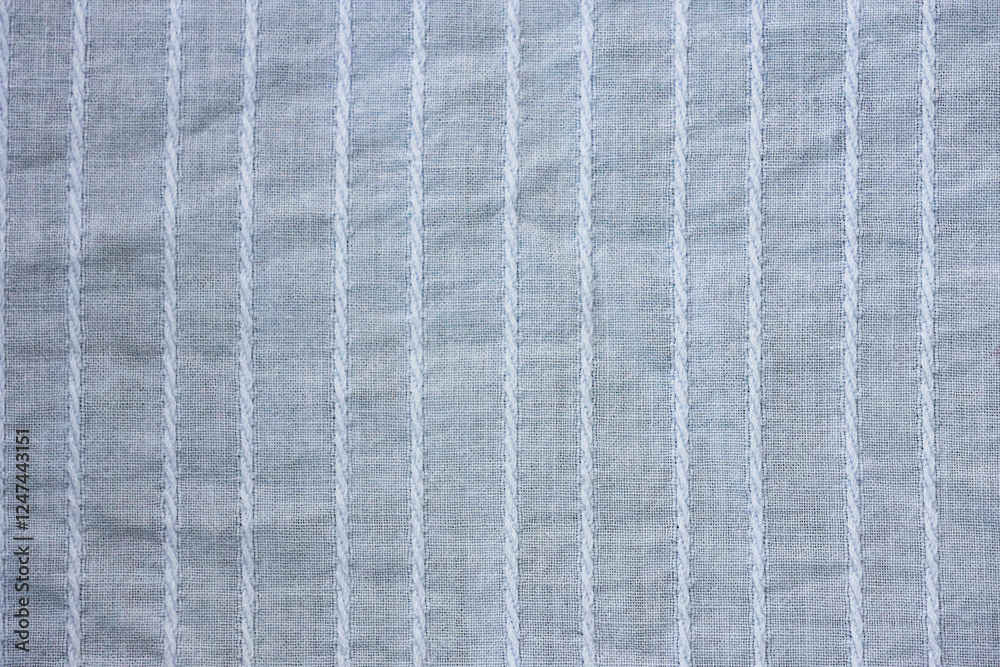 Fototapeta premium Background texture of light blue fabric close-up
