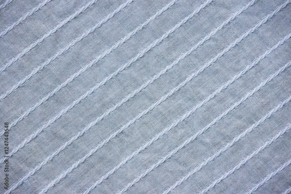 Fototapeta premium Background texture of light blue fabric close-up