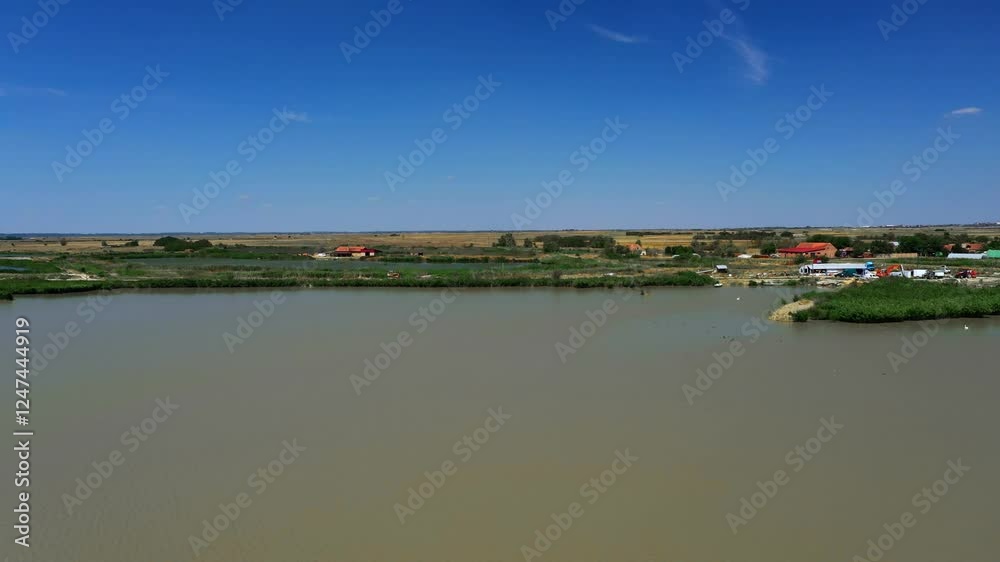 Aerial view of fish farm in Serbia, ponds with fish Aerial view of fish farm in Serbia, ponds with fish
