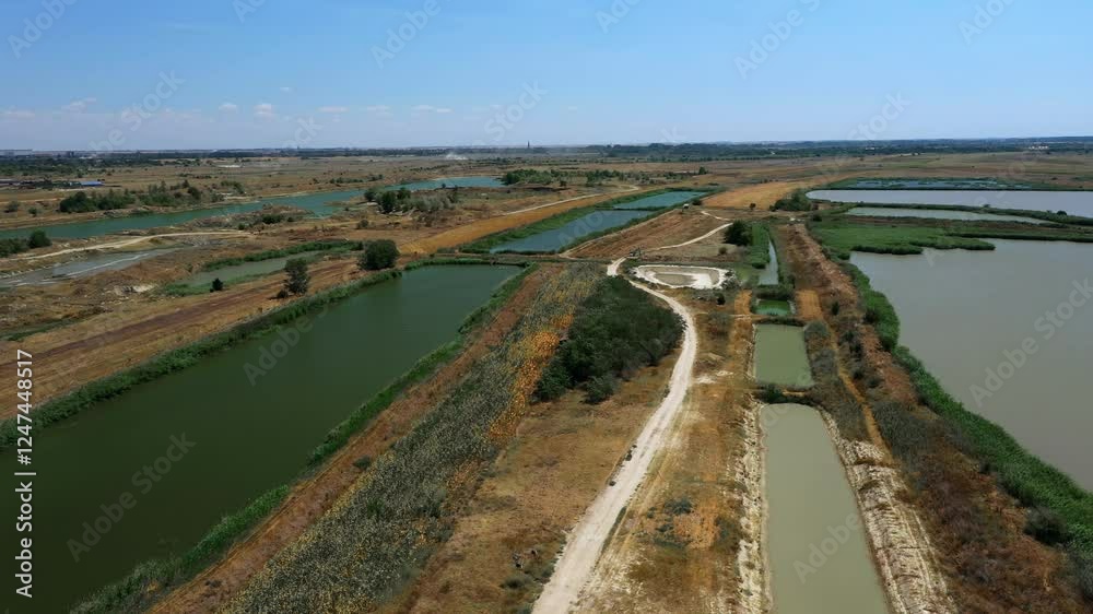 Aerial view of fish farm in Serbia, ponds with fish Aerial view of fish farm in Serbia, ponds with fish