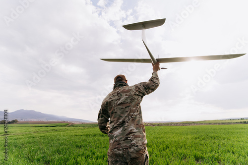 unmanned aerial vehicle in the hands of a soldier. Launching a drone for reconnaissance purposes, unmanned aerial vehicle in the hands of a soldier. Launching a drone for reconnaissance purposes
