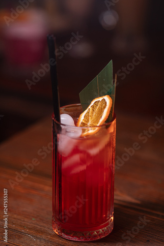 cocktail in a restaurant, professional shooting. a cocktail glass filled with a bright drink, decorated with additional decor. professional photography of a drink