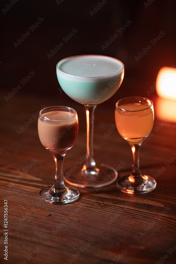 Fototapeta premium cocktail in a restaurant, professional shooting. a cocktail glass filled with a bright drink, decorated with additional decor. professional photography of a drink
