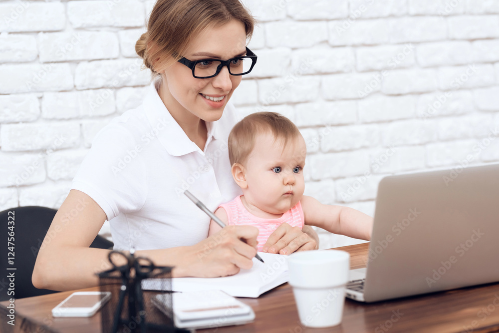Young business lady try to work with baby. Business, motherhood concept. Young business lady try to work with baby. Business, motherhood concept.