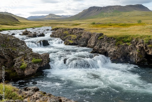 A fast-flowing river cascading over boulders in a rocky landscape