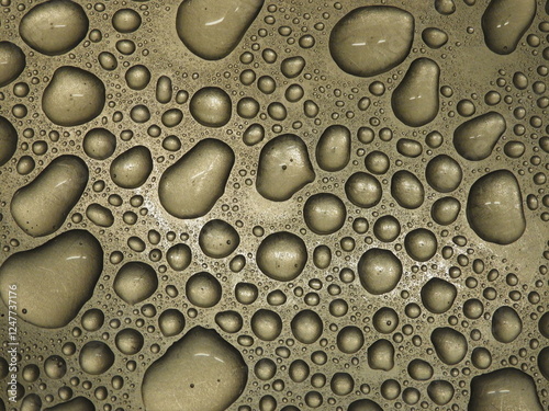 Water drops on metallic surface close up texture
