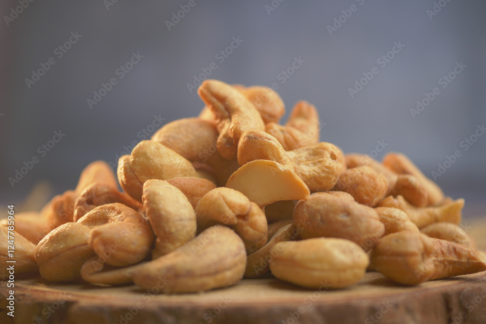 Fototapeta premium Collection of assorted nuts arranged on a wooden surface