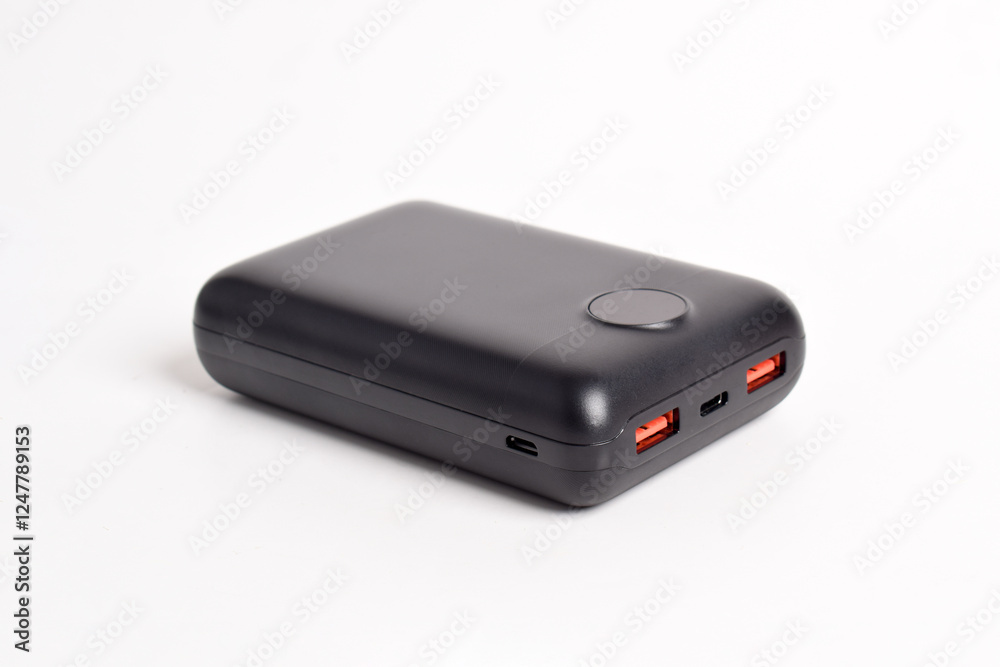 Power bank for charging mobile devices. External battery for mobile devices. Fully charged portable power bank isolated on white background Power bank for charging mobile devices. External battery for mobile devices. Fully charged portable power bank isolated on white background